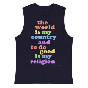 Shirt design features the words the world is my country and to do good is my religion stacked in a stocky serif font. Each word is a different color and the colors follow a slightly muted rainbow